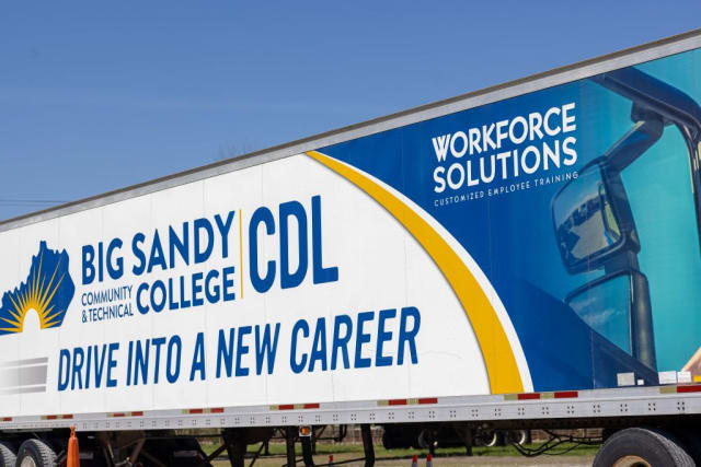 A semi truck covered in Big Sandy Community and Technical College logos.