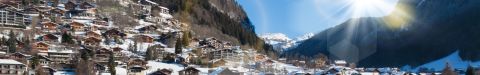 Morzine village and its tree-lined slopes under snow in the French Alps