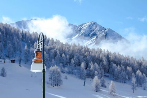 Italian Alps winter landscape with snowy mountain peaks on the background
