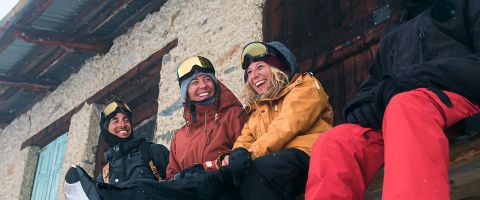 Group of skiers organising a group ski holiday together