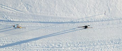 Cross-country skier gliding along a Nordic trail