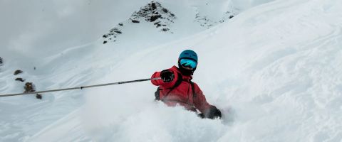 Solo skier enjoying a ski holiday alone on the mountain