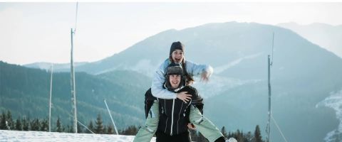 Couple on a romantic ski holiday in the snow