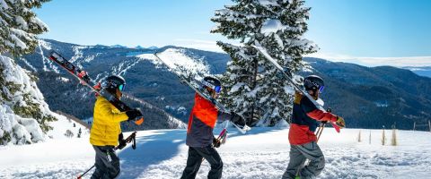 Instructor teaching beginners during a ski lesson