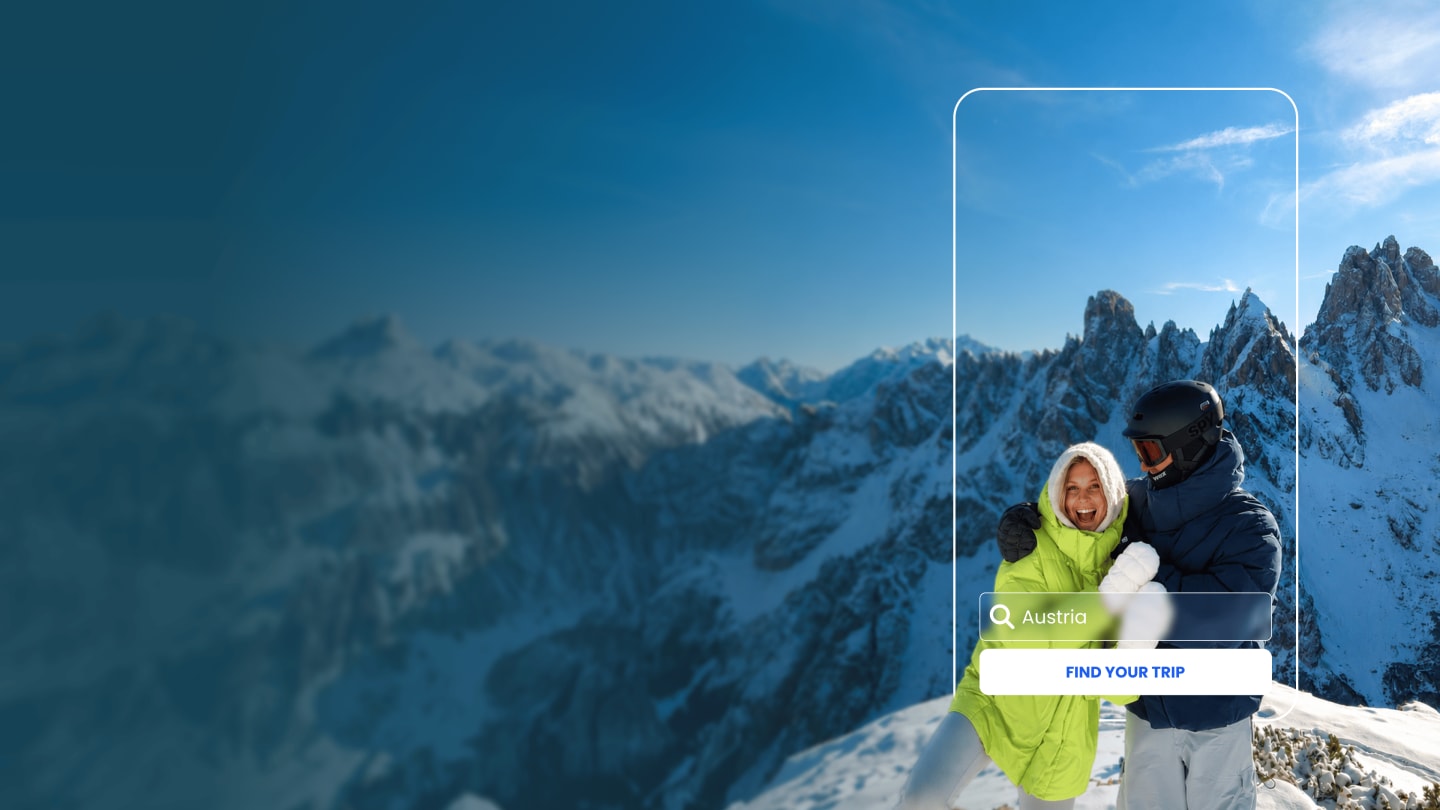 Couple standing together on a snowy summit