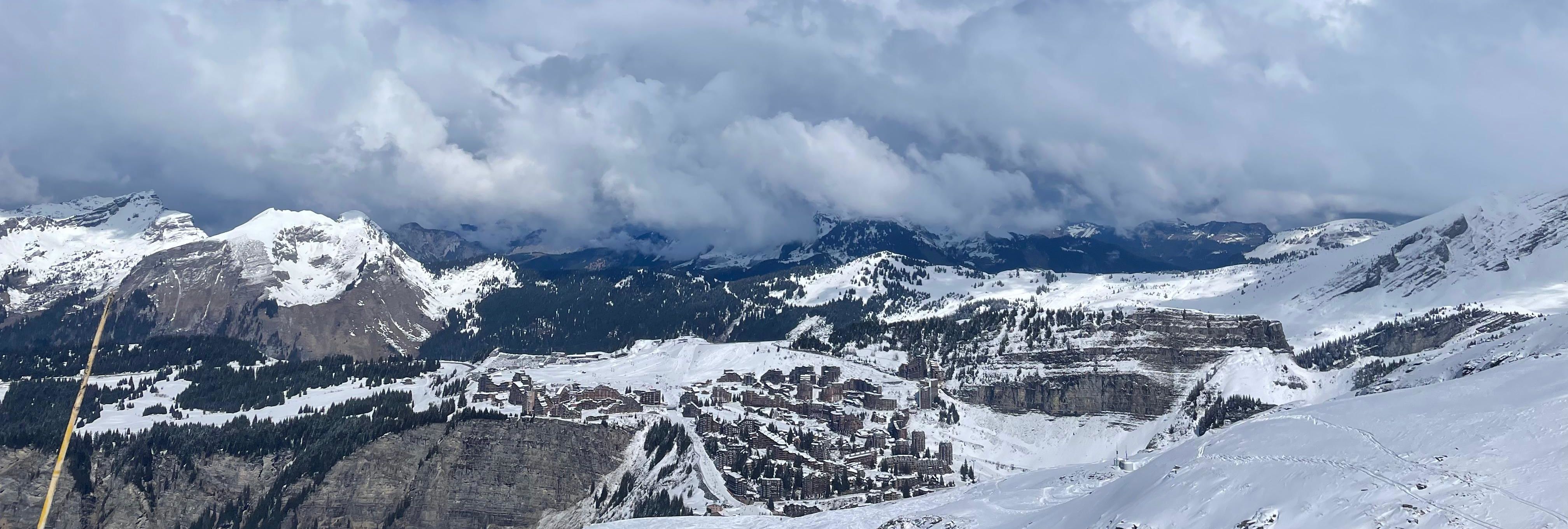 Looking down from Grandes Combes over snowy ridges, pistes and the rooftops of Avoriaz