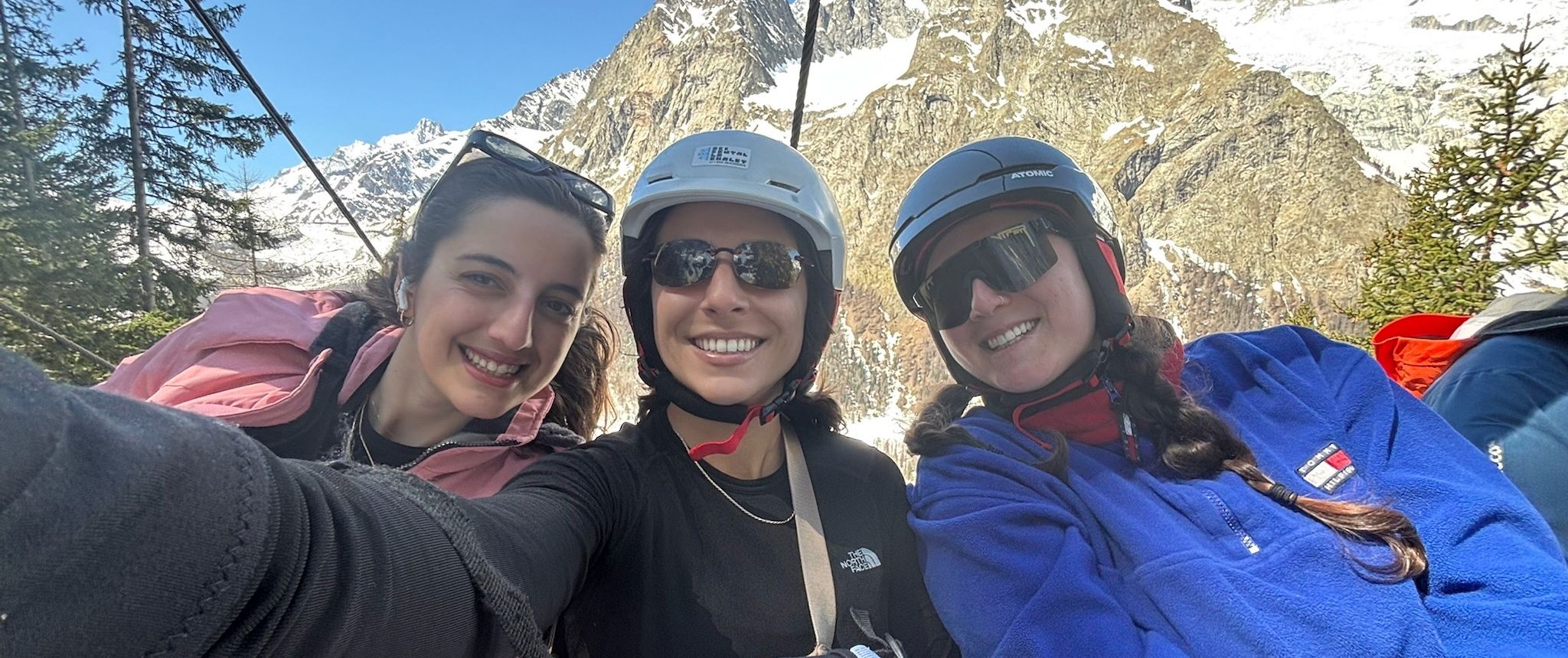 Rachel Hockman and two friends on the chairlift in Courmayeur, with Mont Blanc behind them