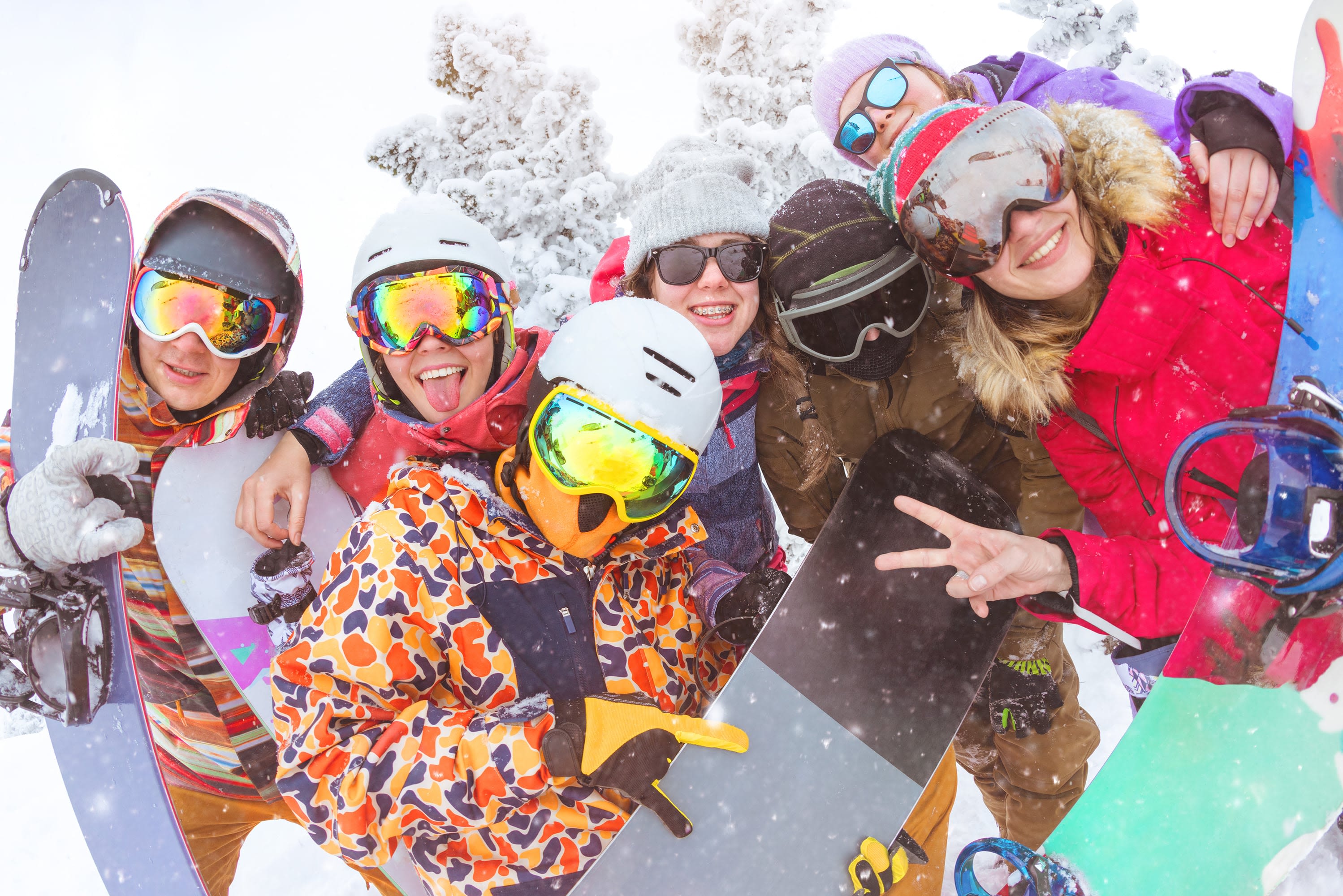 A group of skiers together on the mountain