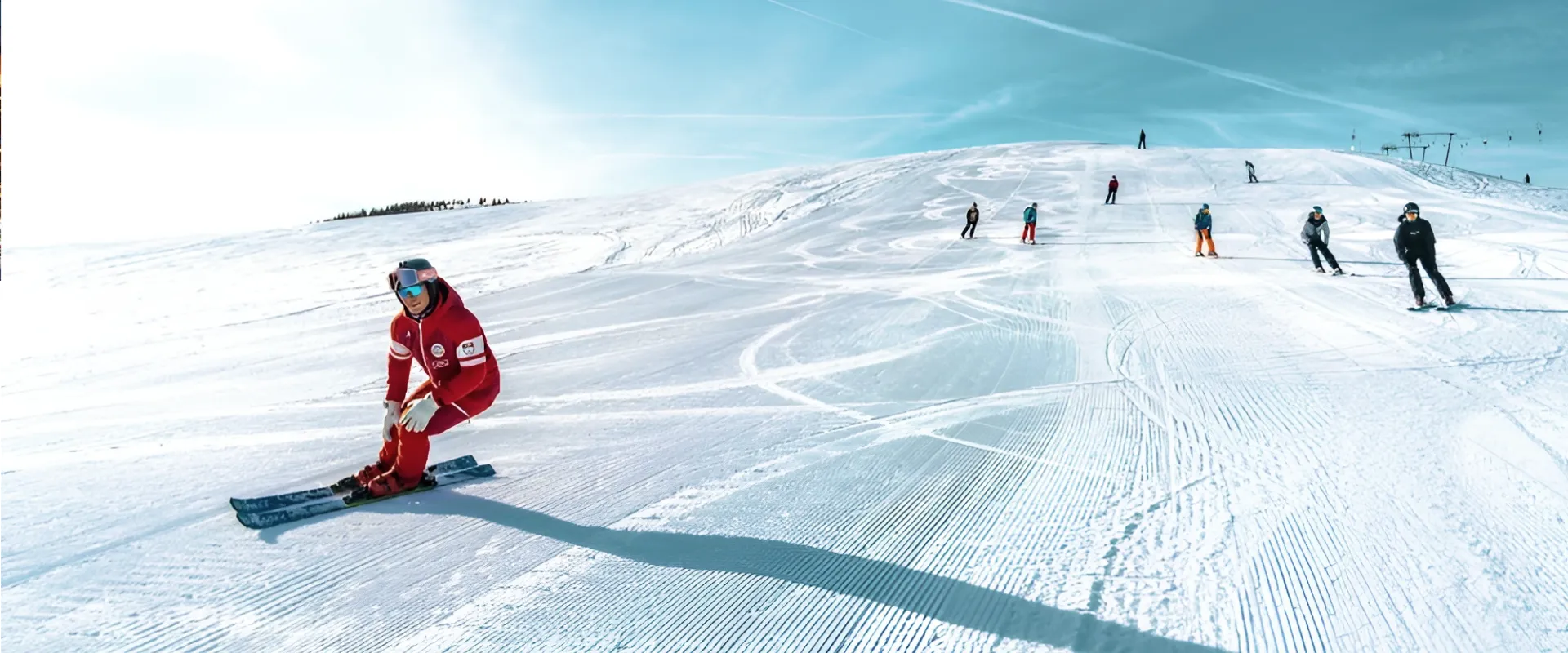 Ski school instructor teaching at a top resort for lessons