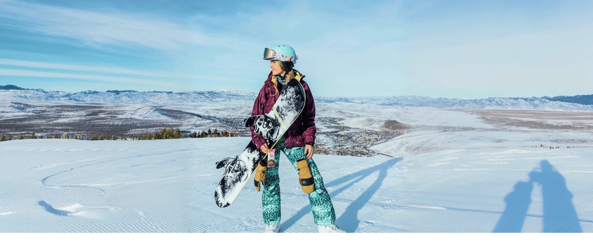 Beginner learning to start snowboarding on a slope