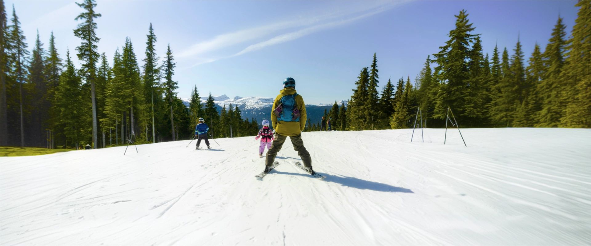 Family skiing together on a family ski holiday