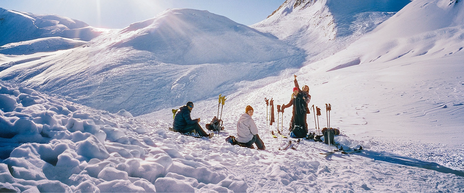 US skiers on a sunny Alpine piste