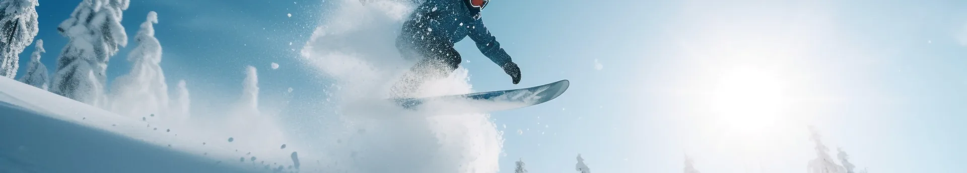 snowboarder off-piste jumping over fresh powder