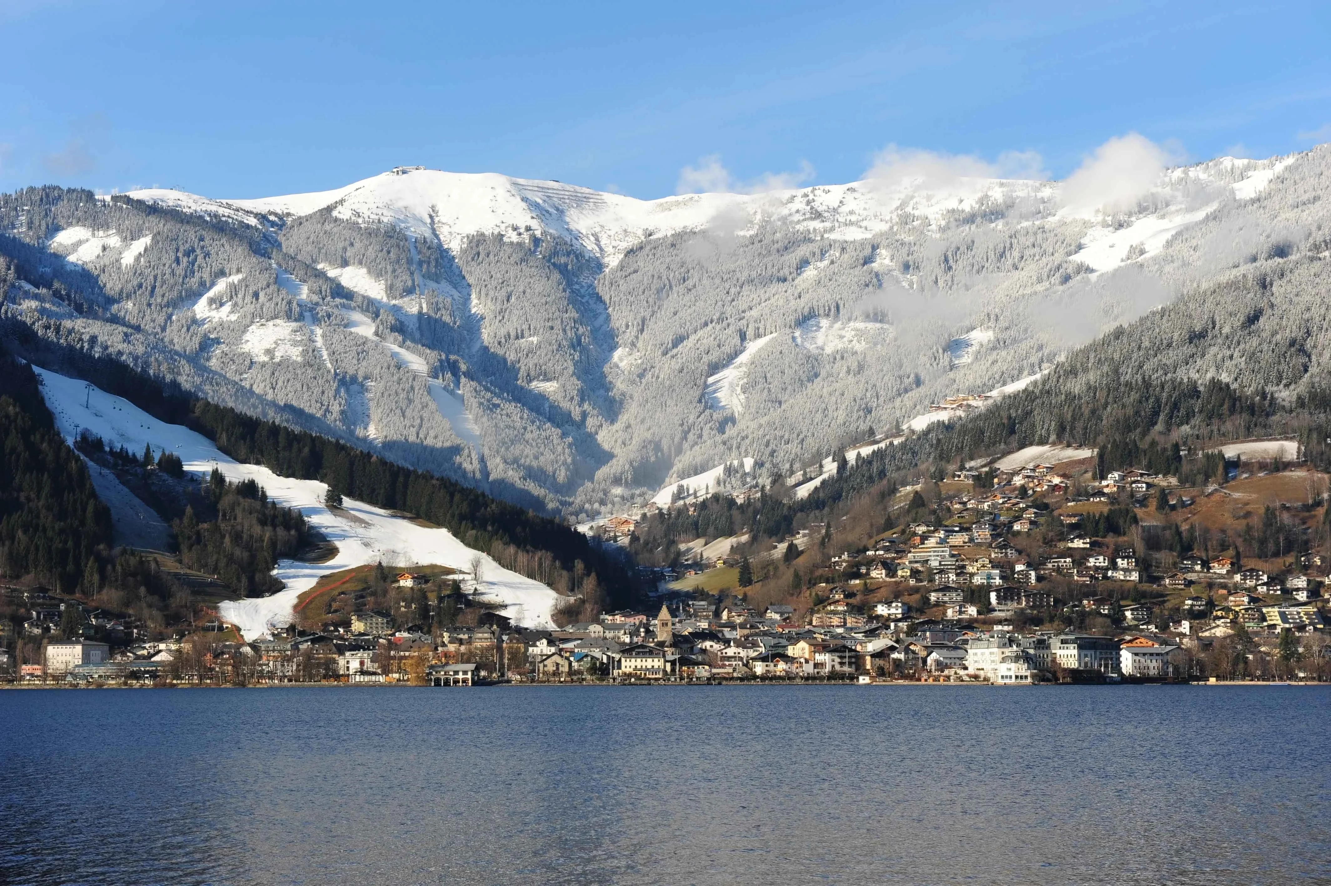 Zell am See ski resort winter time lake view under a blue sky