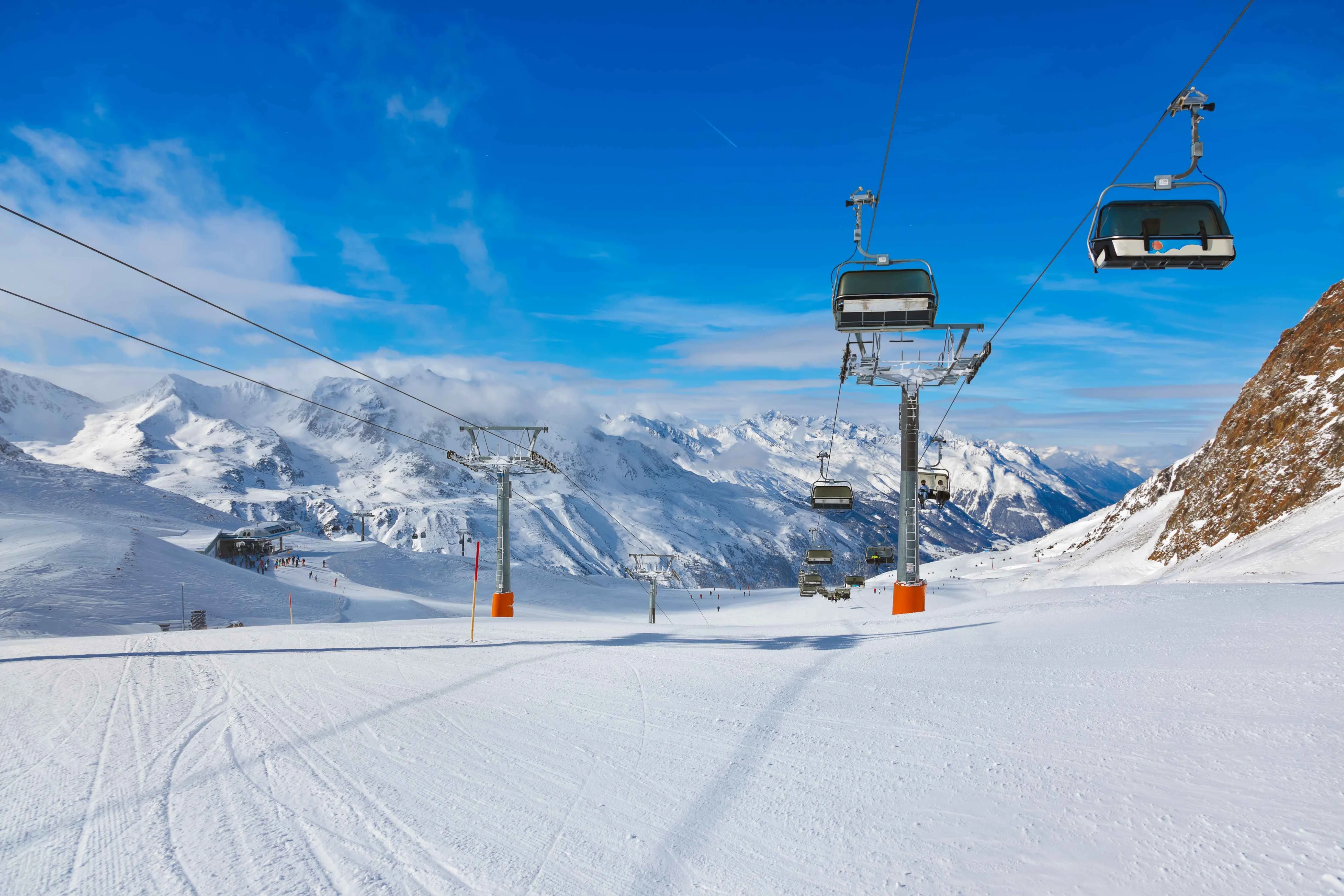 Sunny ski piste with chairlifts in the Austrian Alps