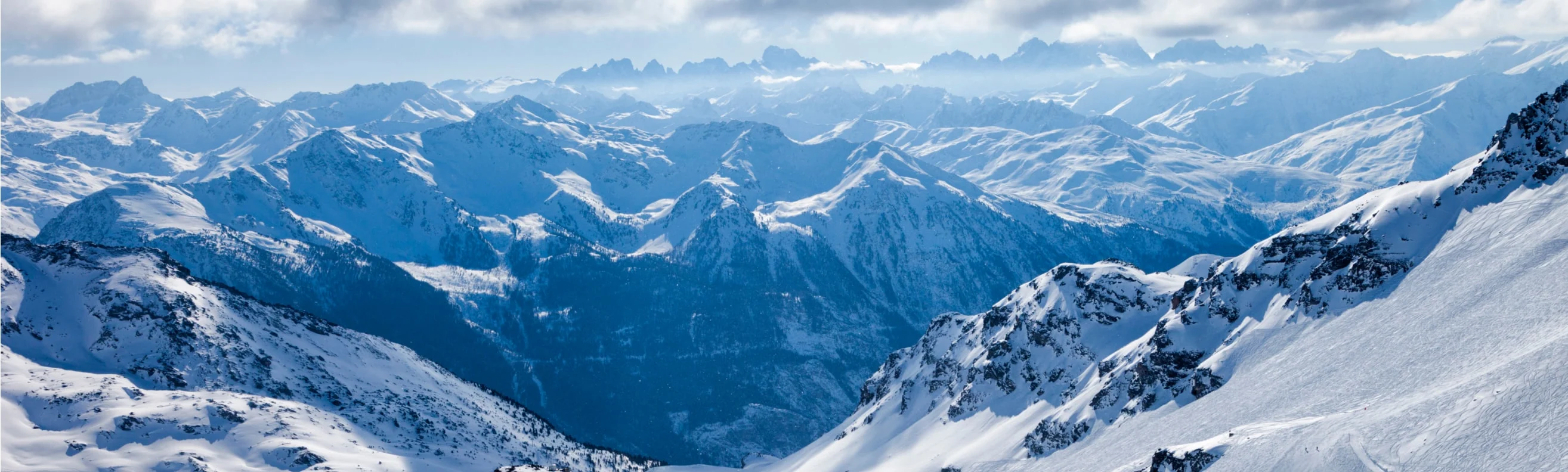 Panoramic view of snow-covered mountain peaks at Verbier ski resort, Switzerland.