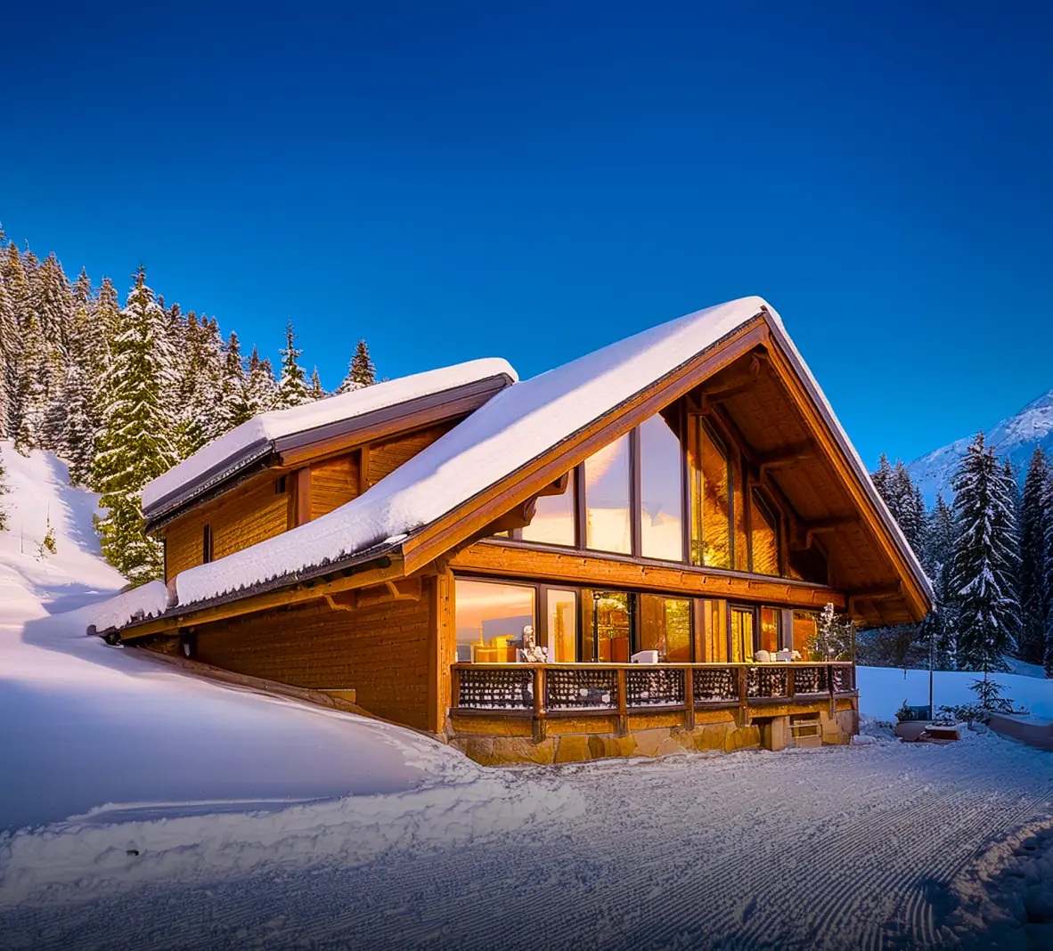 Cozy chalet with large windows and snow-covered surroundings in a ski resort