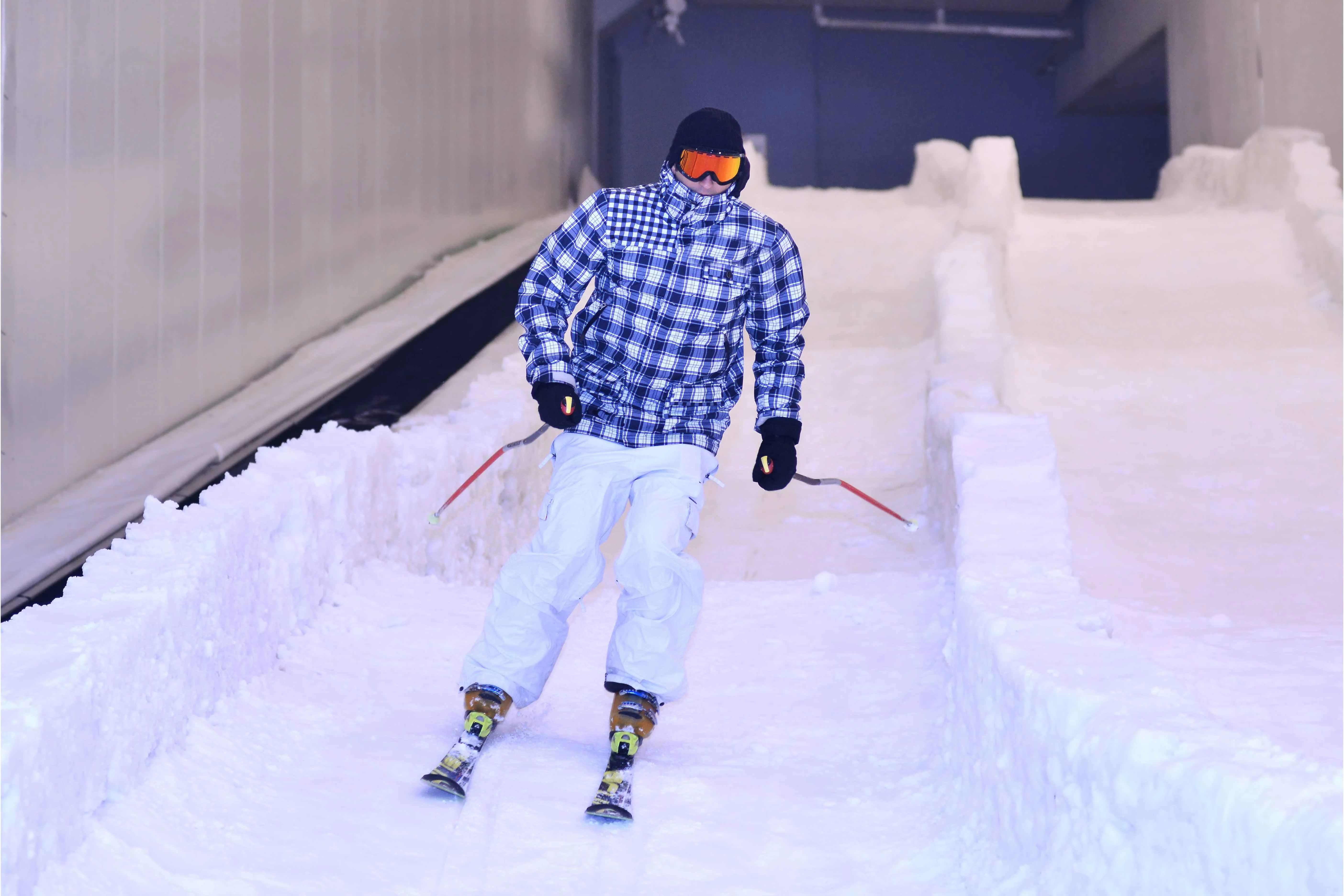 Person skiing indoors on an artificial snow slope
