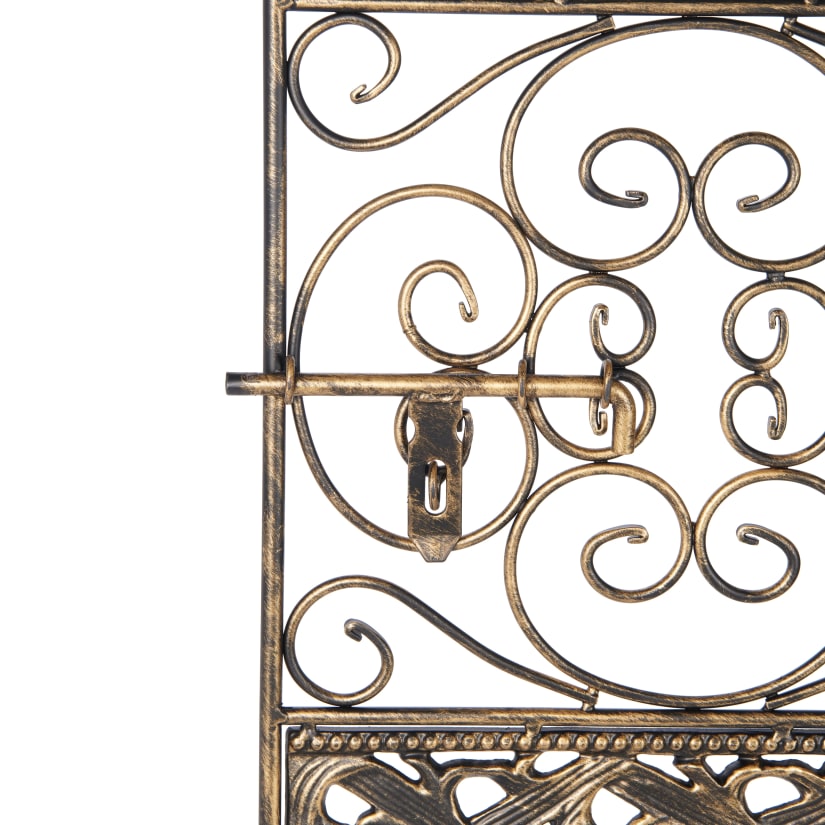 Close-up of ornate scrollwork on wine rack