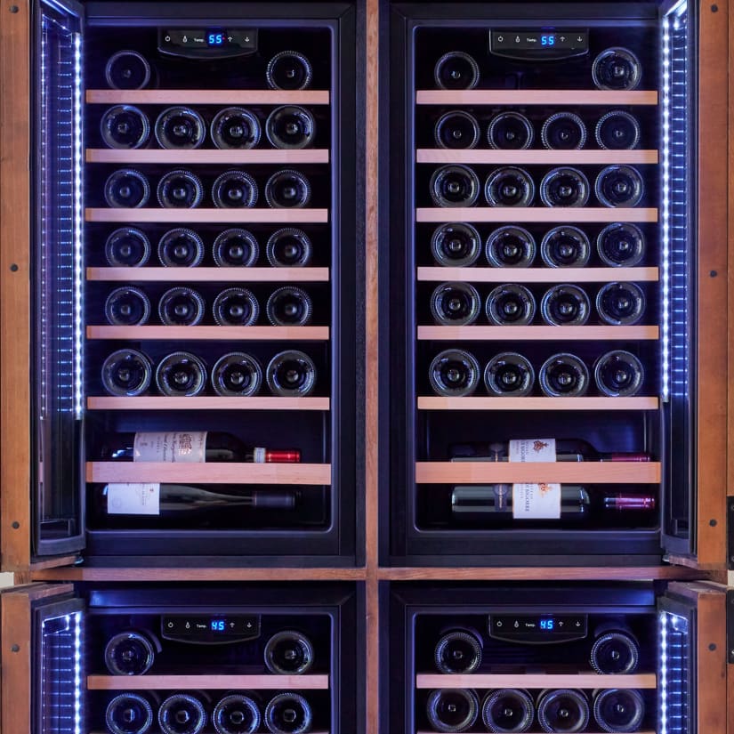 Interior cooling unit and wooden racks inside wine cabinet