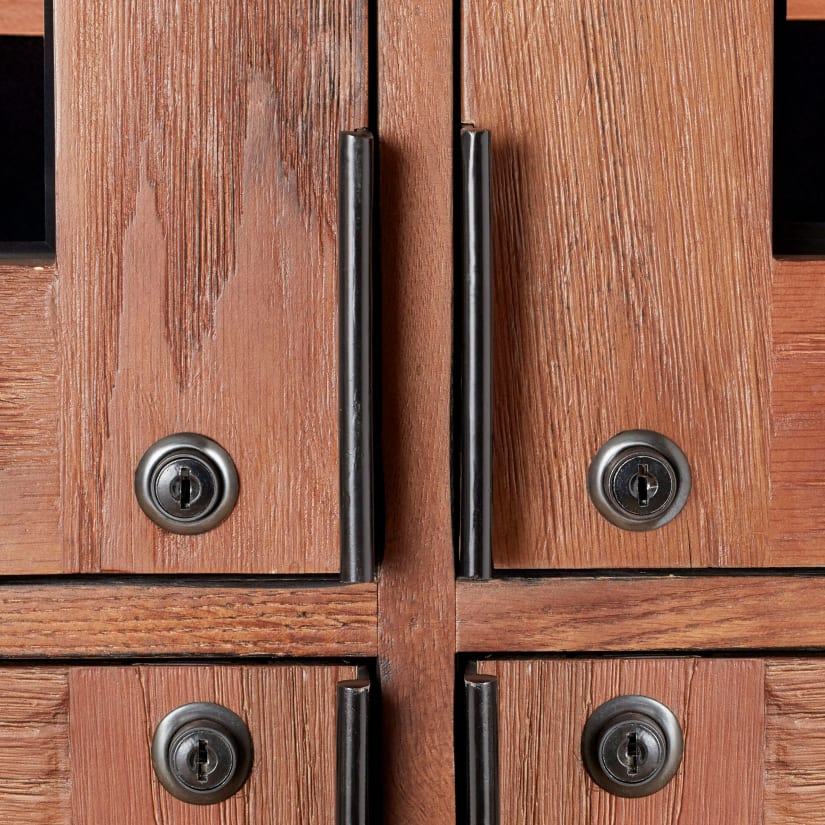 Close-up of door handles and wood grain
