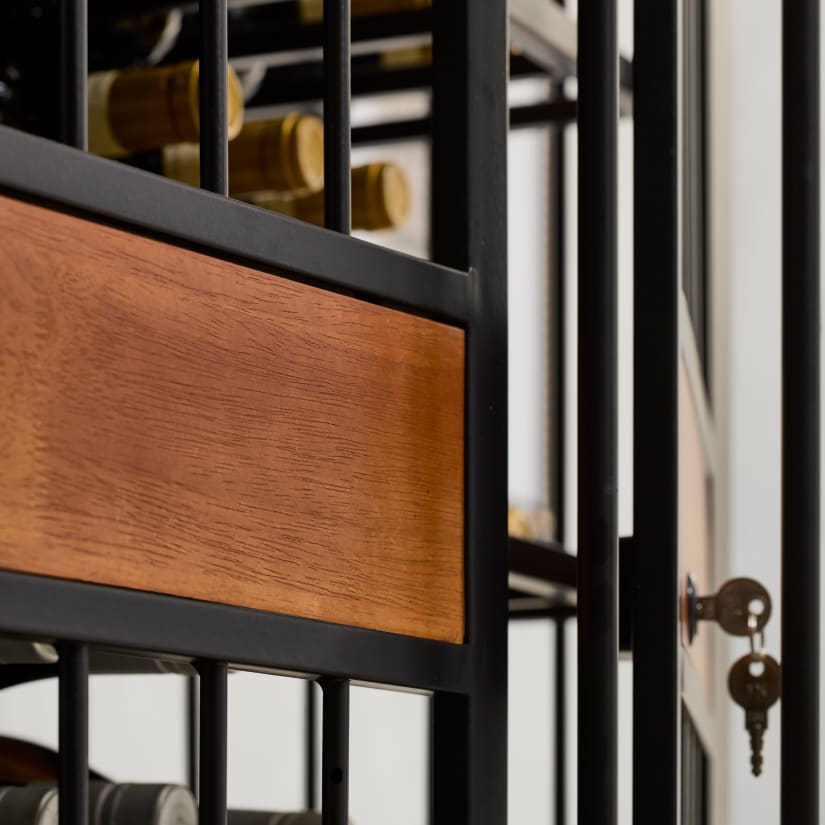 Close-up of wooden drawer panel on metal wine rack