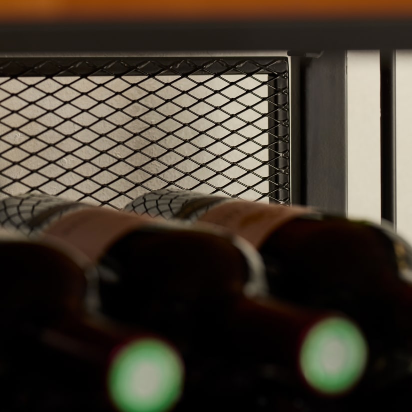 Close-up of metal mesh and bottle rack detail