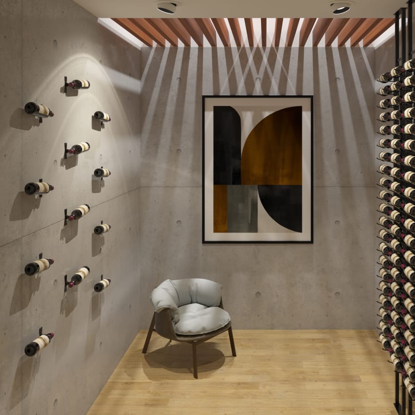 Wine rack installation showing bottles on angled walls with chair and artwork