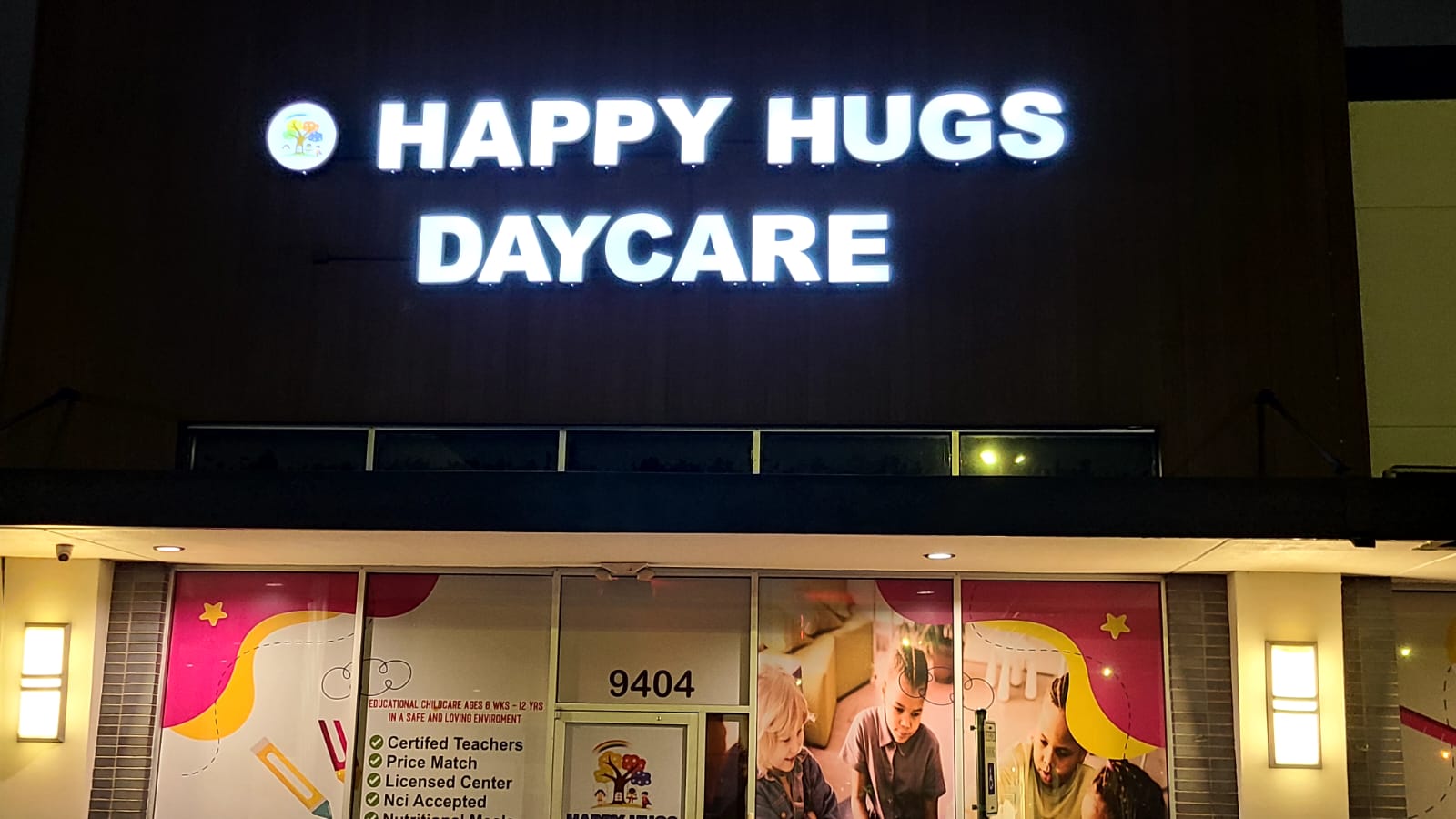 Night-lit daycare storefront with bright channel letters