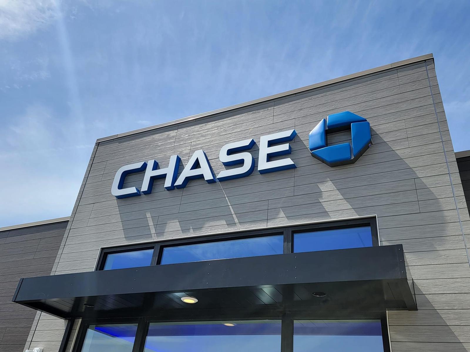 Corporate channel letters with logo mark on a facade