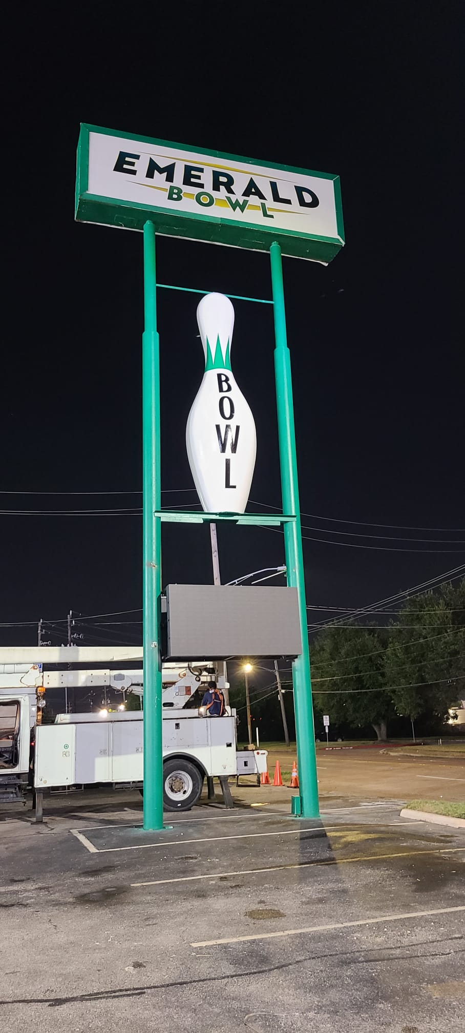 Tall roadside directory sign for an entertainment venue