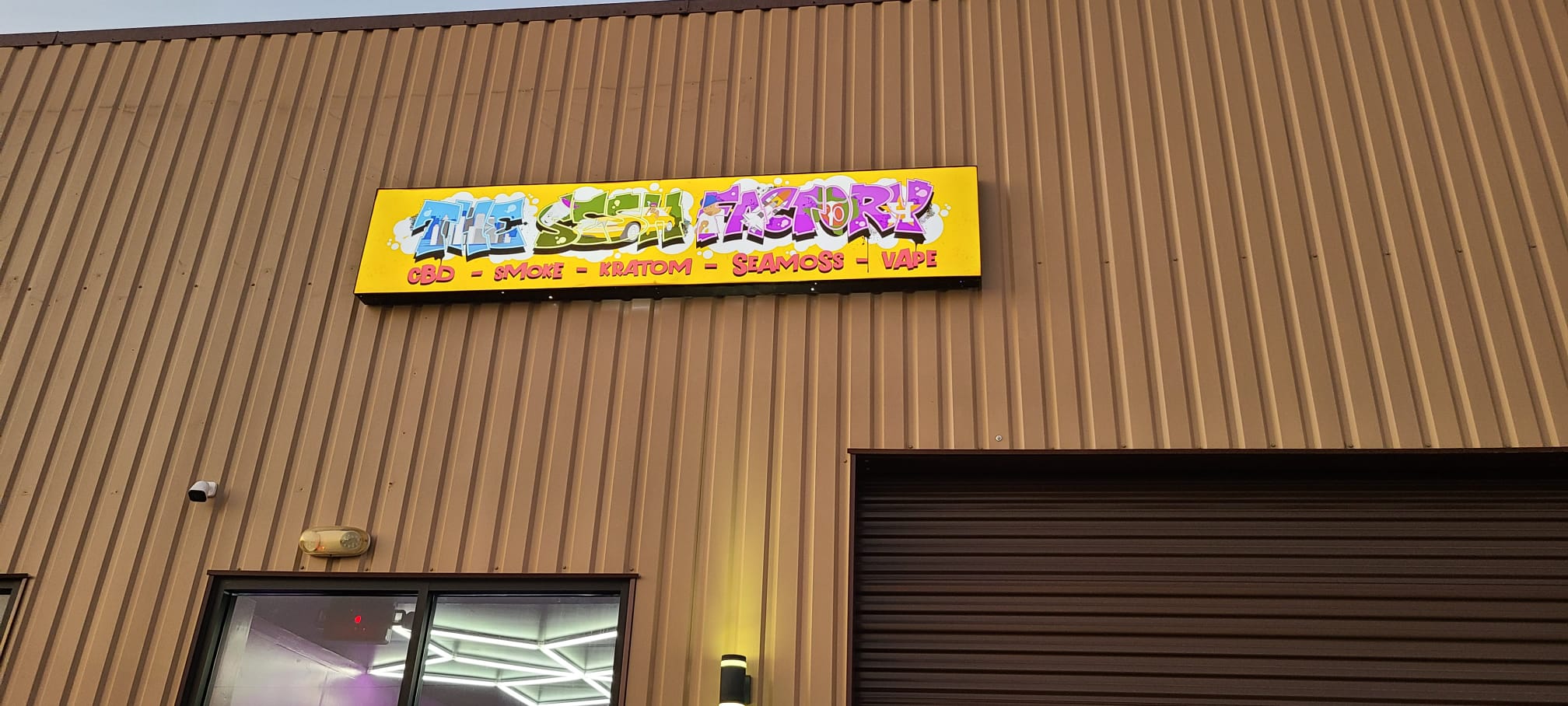Custom printed lightbox graphic on a storefront building