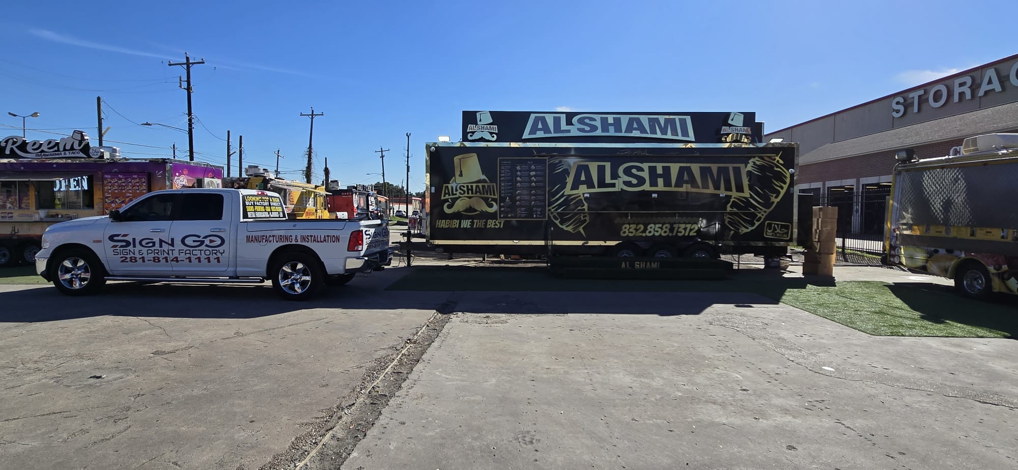 Branded company truck beside a completed food trailer