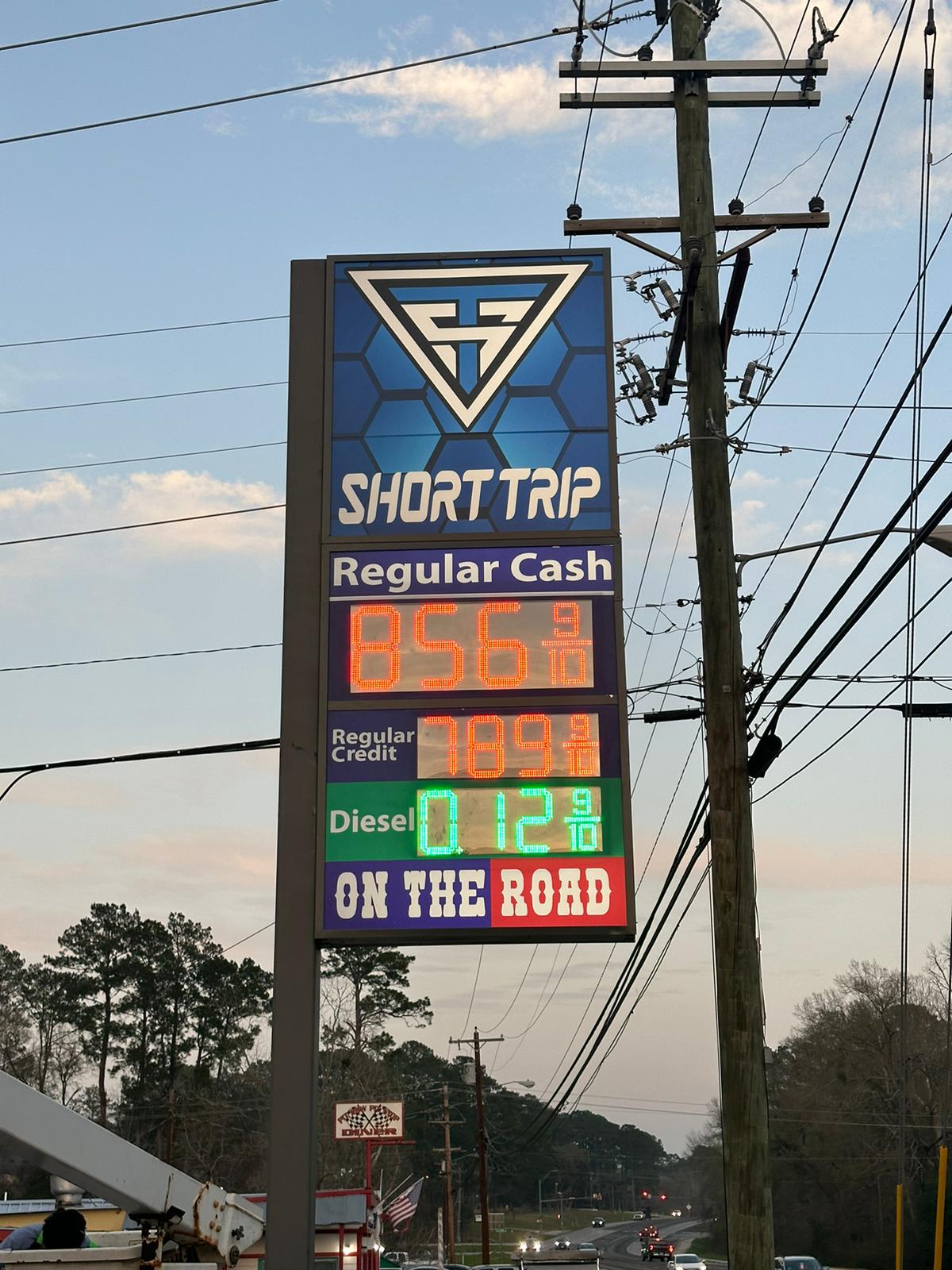 High-rise gas station pole sign with LED pricing