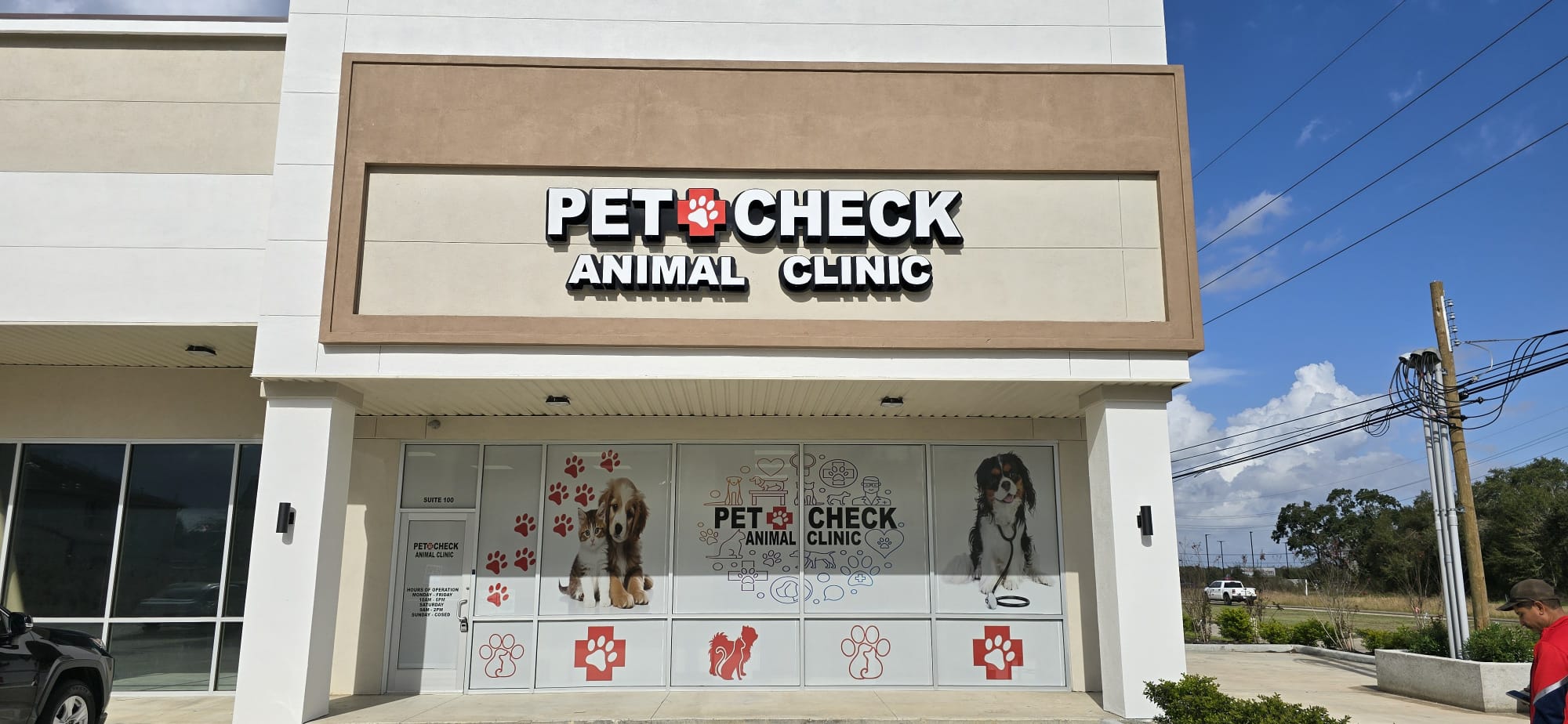 Pet clinic storefront with graphic window decals
