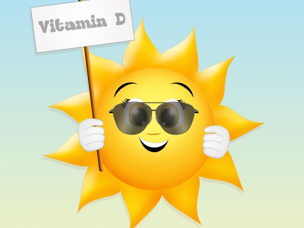 Güneş elinde d vitamini yazan afiş tutuyor