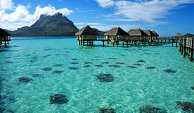 Holland America Line huts over the crystal clear water of Bora Bora the paradise