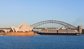Holland America Line ship passing under Sydney Harbour bridge