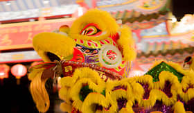 Princess Cruises acrobats are performing a lion and dragon dance