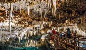 Regent Seven Seas Cruises guests inside Crystal Cave in Bermuda