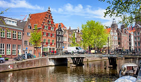 Silversea Cuises bridge and traditional dutch houses Oudezijds Voorburgwal canal Amsterdam Netherlands