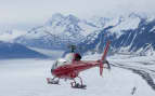 Helicopter flying over remote Alaskan glacier