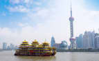 Dragon boat through the Shanghai Skyline China