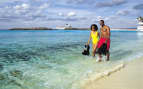 A couple enjoys a walk on Great Stirrup Cay