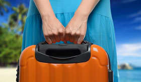 Woman holding suitcase