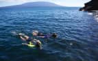 couple snorkeling off the coast Celebrity Cruises