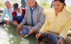 guests panning for gold in Alaska Holland America