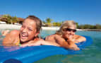 Family enjoys floating on a raft in the Caribbean