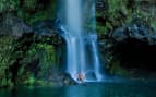 Couple under Hawaiian Waterfall