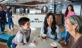 Family enjoying coffee and ice cream at Coffee & Cones on Caribbean Princess